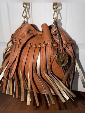 Michael Kors Christy Fringe
Drawstring Bucket Bag